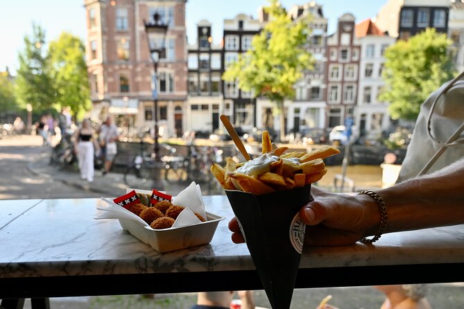 10 Tastes of Amsterdam: Food Tour by UNESCO Canals and Jordaan - Flower Market stroll by Singel Canal