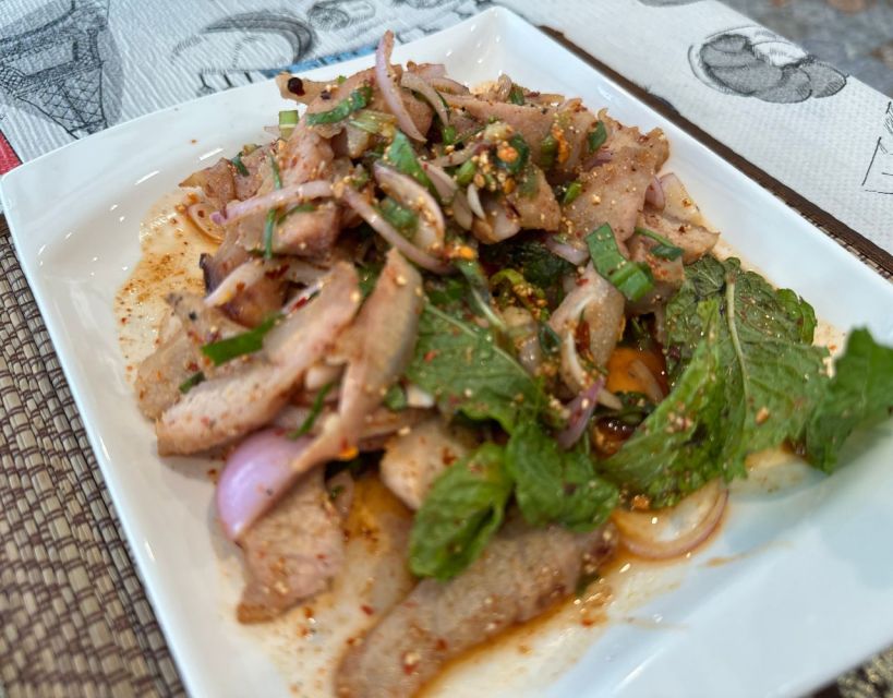 Bangkok Adventure Tuk Tuk Food Tour - Rooftop bar finale: mocktail, river views, and Wat Arun at night