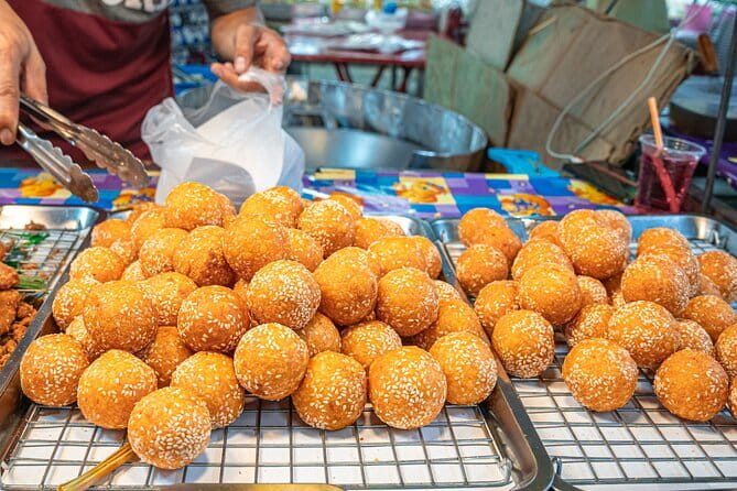 Bangkok Evening Food Tour by Tuktuk - Mahanak Market: fried plantains, lemongrass sausage, and the street-food rhythm