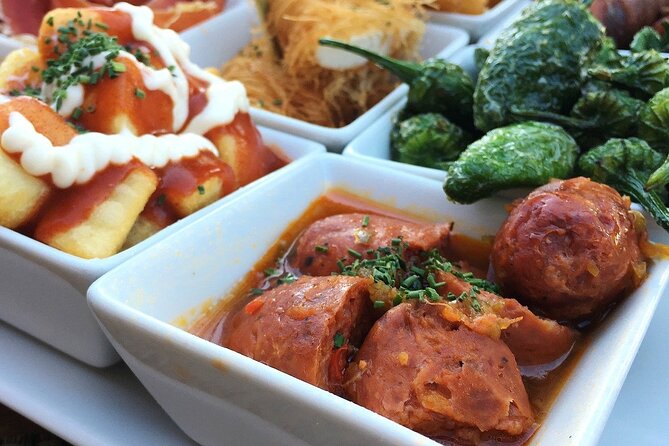Barcelona Food Tour: Tapas, Drinks and Delights with a Local - Carrer de la Mercè: a long-running tapas bar and classic pairings