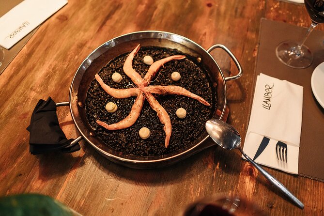 Barcelona: Guided Food Walking Tour with Tapas and Wine - The family-run bodega since 1945: boquerones, butifarra, and a porrón