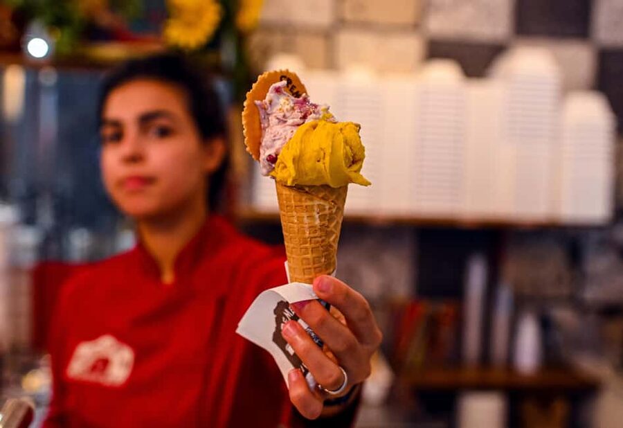 Bologna: 3-Hour Secret Food Tour - Meeting at Palazzo della Mercanzia with an orange umbrella