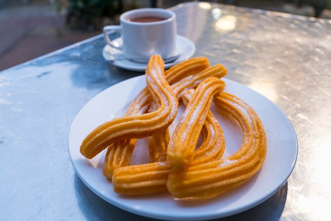 Cadiz Food Tour: Tapas, Drinks and Delights with a Local - Passing Torre Tavira and grabbing sweets to go