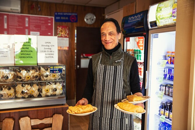 Eating Amsterdam: Albert Cuyp Market & The Pijp Food Tour - Stop 2: Johan Kaas in the Albert Cuyp Market for smooth, nutty Gouda