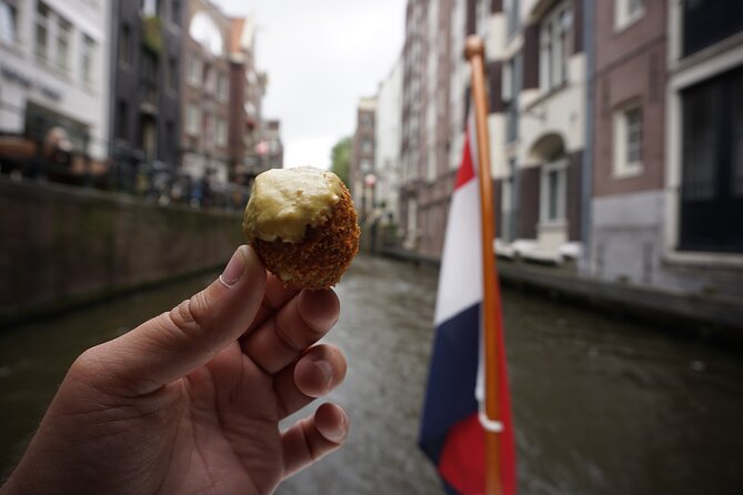 Eating Amsterdam: Food Tour & Canals Cruise - Fish at Vishandel Centrum: herring and kibbeling in an open kitchen