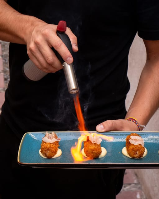 Explore Marbella Old Town: Authentic Tapas Food Tour - Stop Two: second bar plates, more local snacks, and another wine glass