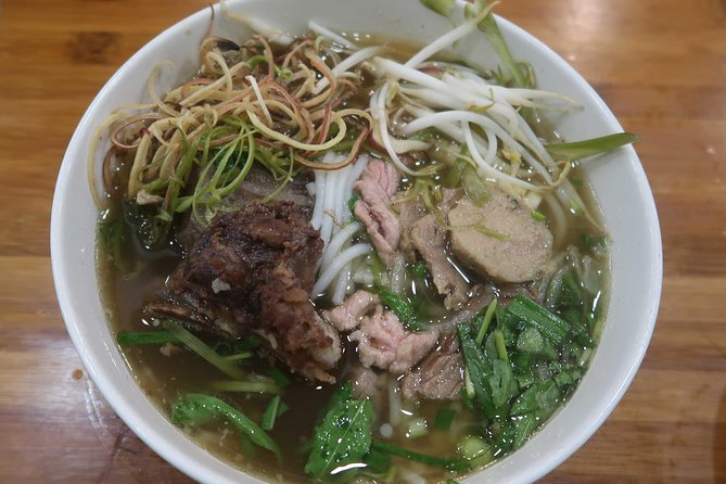 Ho Chi Minh Private Half Day Street Food Tour with Local Students - BBQ pork with rice noodles: the satisfying middle stop