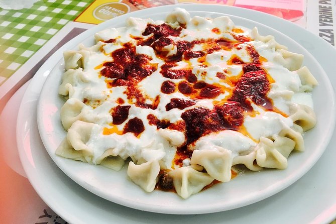 Istanbul Kadikoy Private Food Tour with 12+ Local Tastings - Stop 1 on Doktor Esat Işık Caddesi: Turkish breakfast with street-art energy