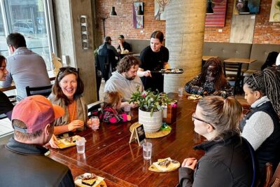 Kelowna: #1 Rated Walking Food Tour with 7 Tastings and 4 Drinks - Dolphins Statue and Waterfront Park: quick stories, big lake energy