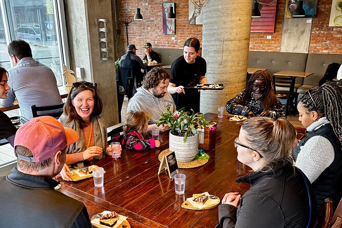 Kelowna: #1 Rated Walking Food Tour with 7 Tastings and 4 Drinks - Dolphins Statue and Waterfront Park: quick stories, big lake energy