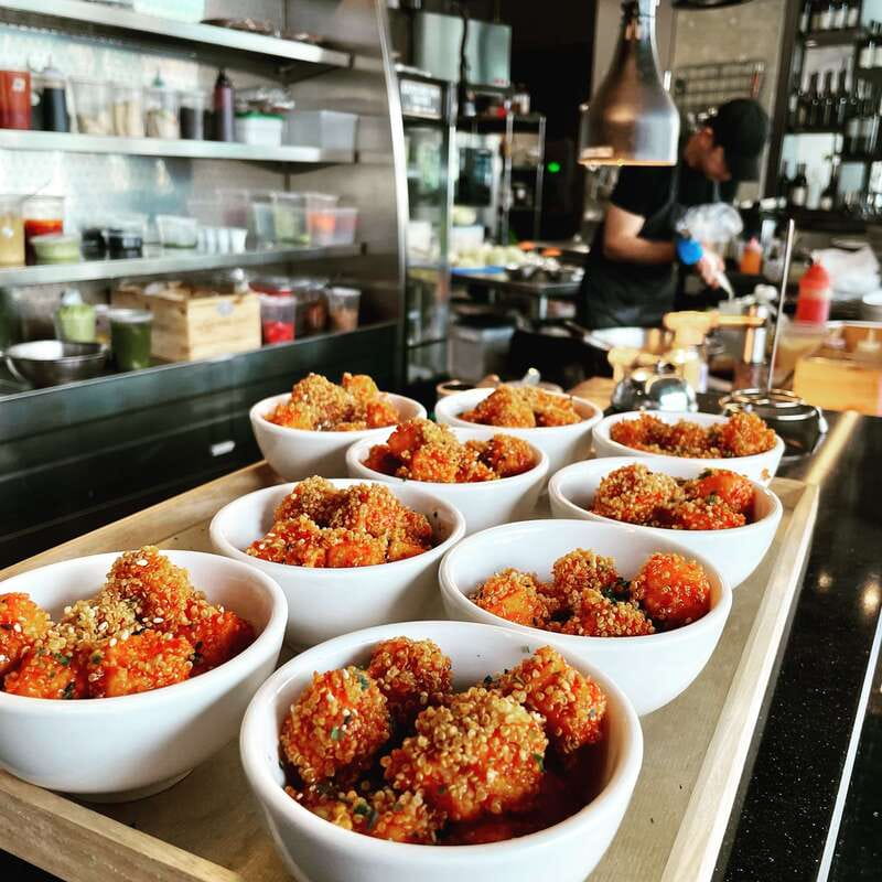 Kelowna: Walking Food Tour with 7 Tastings and 4 Drinks - Waterfront Park tastings and boardwalk time on Okanagan Lake