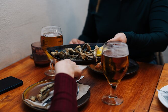 Lisbon: Award-Winning Guided Walking Food Tour with Local Drinks - Stop 2 (Rua dos Fanqueiros): Petiscos, Wine, and Portuguese Comfort Food