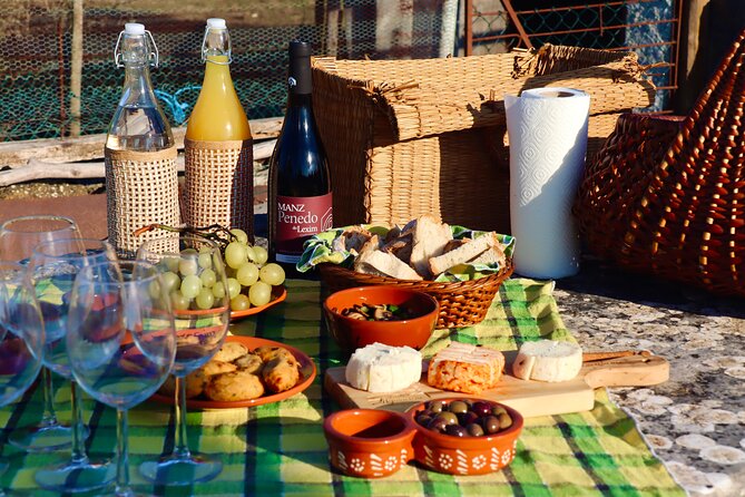 Lisbon Countryside Food Tour on a Vintage Car - The rustic village picnic: local products on a stone table