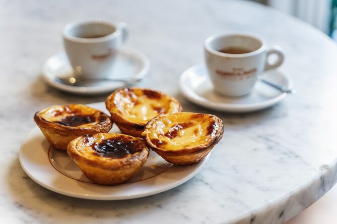 Lisbon Flavours: Baixa Guided Food Tour with Portuguese Wine - Rua dos Fanqueiros: Petiscos, Chouriço, and Bacalhau à Brás