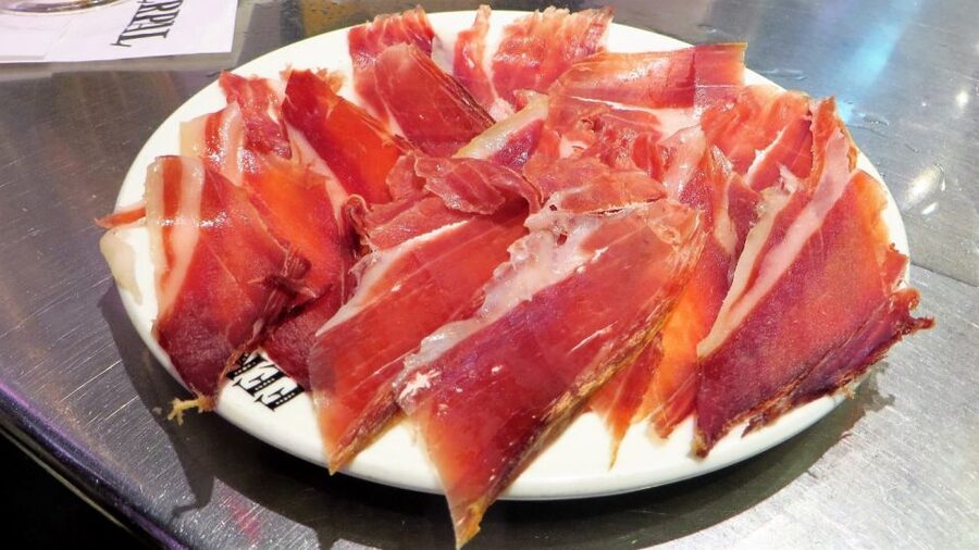 Madrid: Iberico Ham and Spanish Wine Small-Group Food Tour - Jamonería time: learning ham grades while tasting real cuts