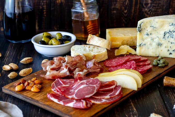 Paris Le Marais: Private French Food & Wine Walking Tour - Stop 1 at Le Sancerre: charcuterie and cheese at Paris’ oldest market feel