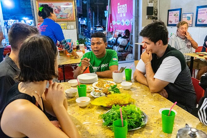 Phnom Penh Evening Food Tour - Inclusive 5 stops local Tastings - Stop 1: Riverfront snacks and a quick taste of local life
