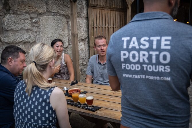 Porto Craft Beer Tour: 7 Beers + 3 Food Pairings in a Small Group - Stop 2: Mercado do Bolhão Turns Beer Into a Local Food Moment