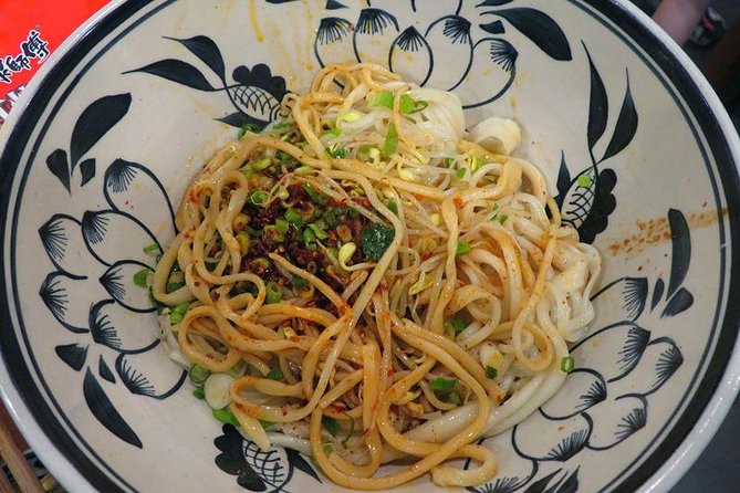 Private Xi’an Night & Food Tour by Tuk Tuk and Public Transportation - Muslim Quarter at night: street food, big flavors, real bargaining