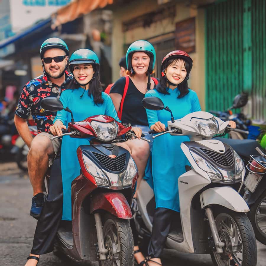 Saigon: Michelin Guide Food Tour with Ao Dai Female Riders - Safety, helmets, and rain ponchos: the small details that keep things stress-free