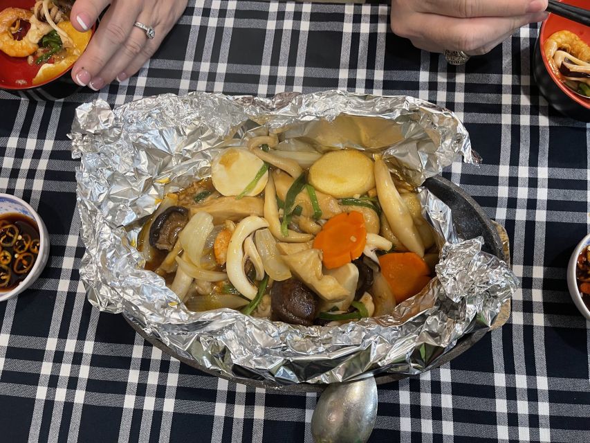 Saigon: Night Craft Beer And Street Food Tour By Vespa - Flower market snack time: grilled rice paper with serious toppings