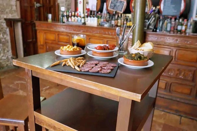 Sevilla Food Tour: Tapas, Wine, History & Traditions - Barrio Santa Cruz finale: albóndigas, pestiños, and a glass of PX