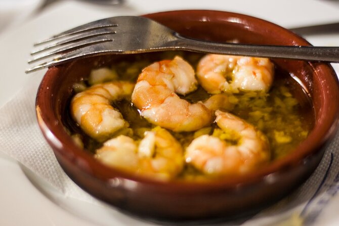 Seville Food Tour: Vermut, Churros & 10+ Tasty Local Dishes - A 13th-Century Watchtower Prison Stop That Adds Context