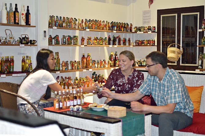 Siem Reap Food Tour by Vespa - Stop 1: Sombai Cambodian Liqueur and souvenirs