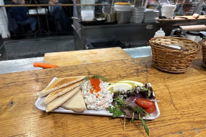 Stockholm Small Group Food Tour with 7 Classic Food Tastings - Hötorget area: flowers, changing eras, and a sweet Swedish finish