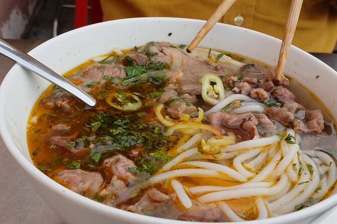 Super Niche Walking Street Food Tour in Ho Chi Minh City - District 3 start: taxis, punctual guides, and staying safe with street crossings