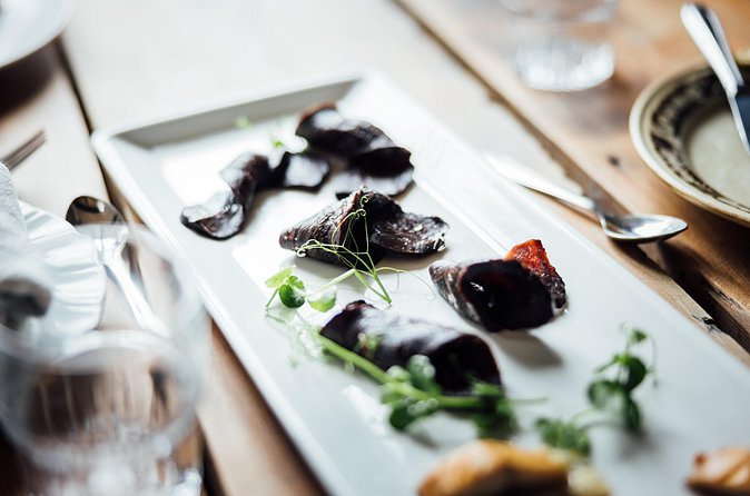 The Tromsø Food Walk, Taste your way through local history - Stop 3: Torgsenteret and Snorre Art (Traditional Snack Meets Local Artwork)