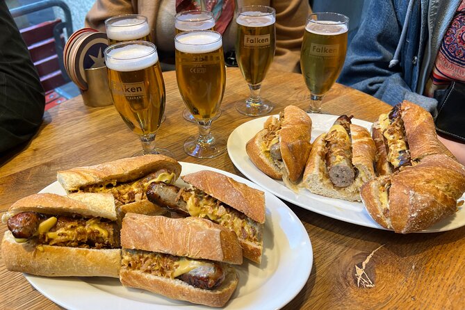 Zurich Food Tour with 10 Local Delicacies, Cheeses & Chocolates - Stop at Limmatquai: breakfast classics plus Zurich street-food flavor
